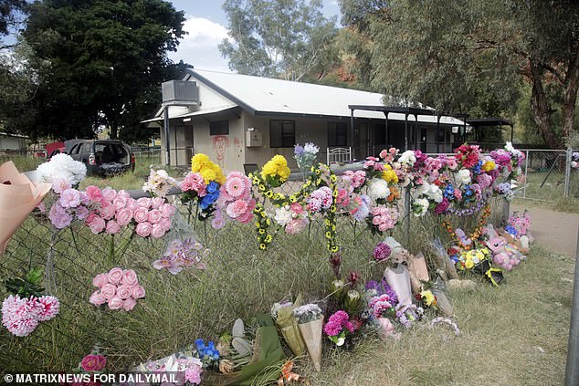 Flowers are seen at the family home of Kumanjayi Little Baby