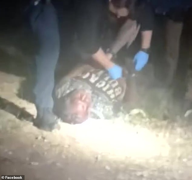 Jefferson is seen being arrested by police after being beaten by vigilante rioters