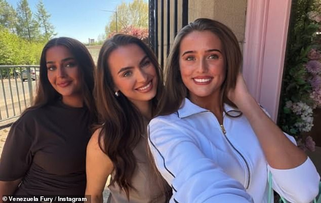 The bride-to-be cut a causal figure in a white sweater and jeans as she posed alongside mum Paris, 36, and pals after making her final decision