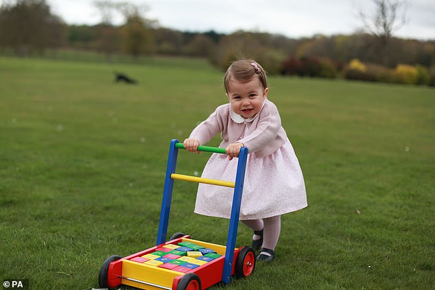 On her first birthday, William and Kate released an adorable snap of her pushing a trolley of bricks