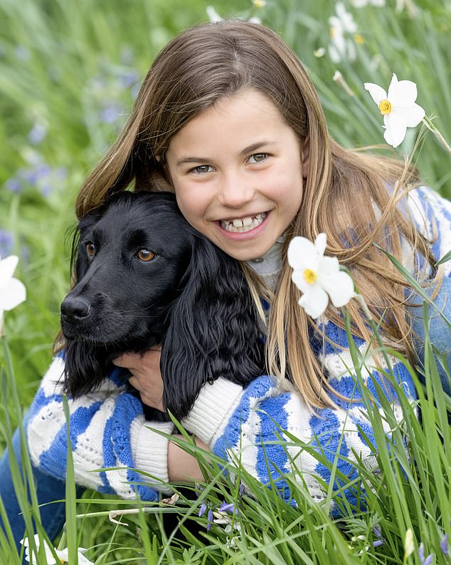 The year before, Charlotte was shown embracing the family's beloved dog Orla