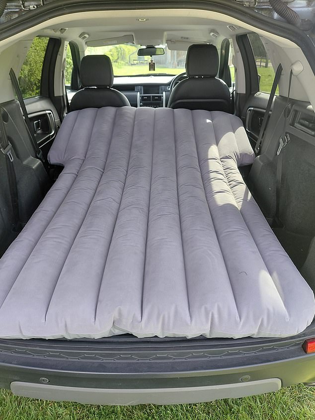 A £19.99 inflatable mattress fits snuggly around the wheel arches, transforming the boot into a small double bed