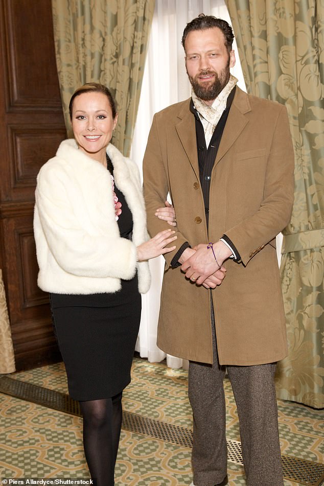 She said still having to live with her husband (pictured, the couple, in 2013) for months after they broke up made 2025 her 'worst year ever'. But the actress insists that now he has finally moved out: 'I don't have a pot to p**s in now but I'm the happiest I've been'