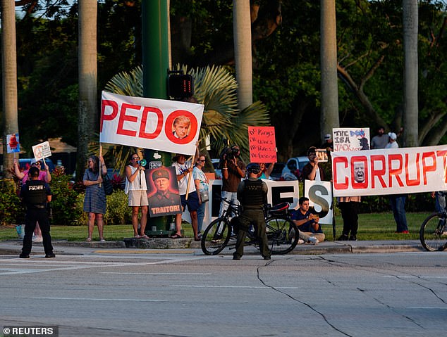 Protestors seen outside the event held at Raymond F. Kravis Center for the Performing Arts