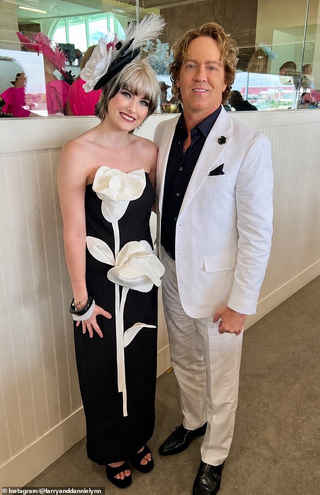 The teenager donned a black Mac Duggal dress, which had an enormous white flower on it, platformed heels and a black and white feathered headpiece