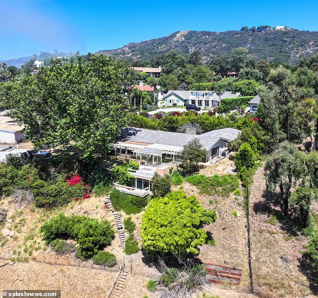 The attorney for the former stripper, who met Hunter in a Washington DC strip club in 2017, argued that Biden's California mansion (pictured) 'overlooking the ocean' was evidence that he could stump up more for their child