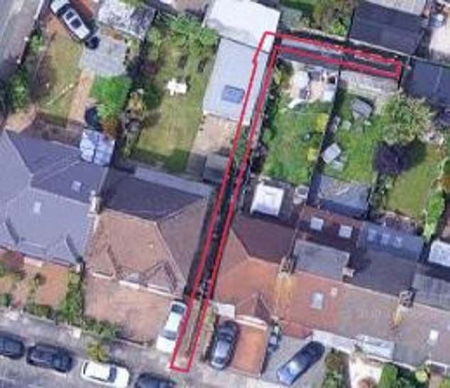The plot stretches alongside and behind a neighbouring house and is separated by a wall and a fence