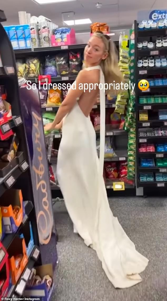 As she walked down the aisle with her trolley she penned: 'He asked me to walk down the aisle again... So I dressed appropriately!'