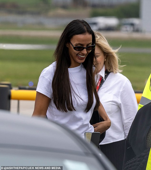 Dressed down in a white t-shirt and cream trousers, Maya wore sunglasses and flashed a nervous-looking smile at airport staff