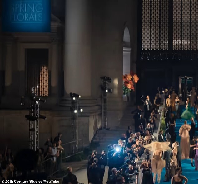 The camera then cuts to the iconic Metropolitan Museum of Art where the Met Gala is taking place, with the theme being 'Spring Florals'