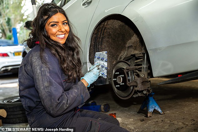Natasha Rawal, founder of London's first all female garage Spanners with Manners, is pictured working on the Prius