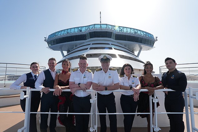 When not overseeing a 1550-strong crew, Craig (pictured, centre) officiates weddings onboard - on rare occasions marrying up to 100 couples at any one time!