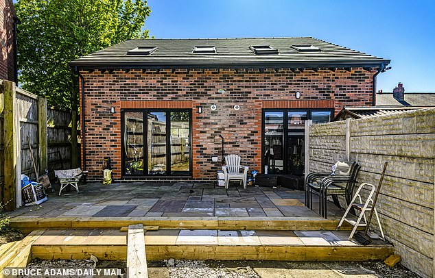 Pictured: The detached home that Mr Perret illegally built in his garden