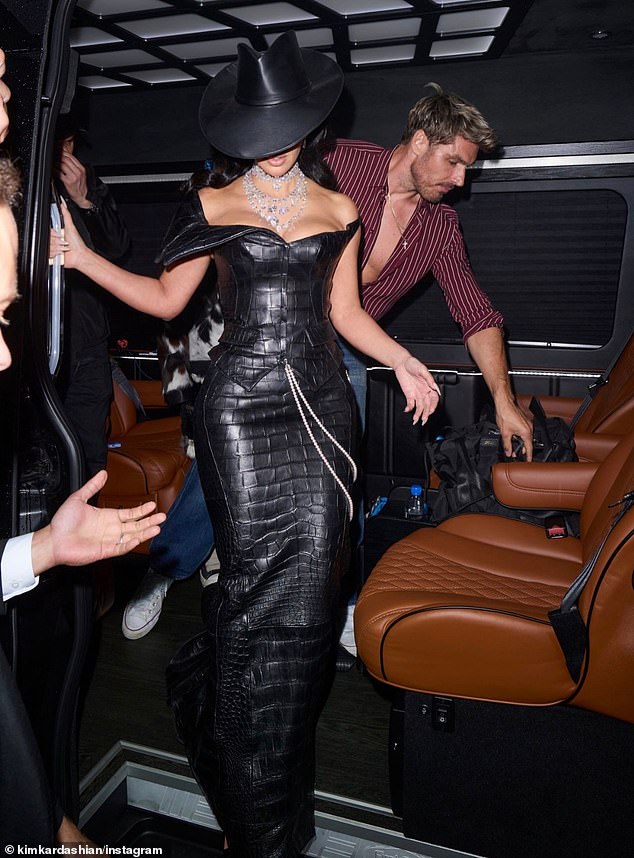 To round off her final Met Gala look, the SKIMs founder wowed in a Chrome Hearts black snakeskin corset with matching skintight skirt, flashing her ample cleavage