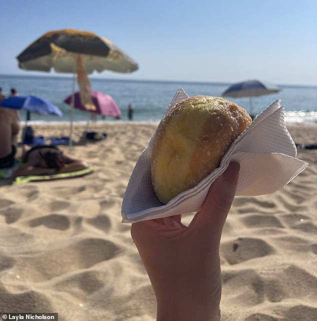 At the beach, Layla and her travel companions tucked into free Portuguese fried doughnuts that they had been given