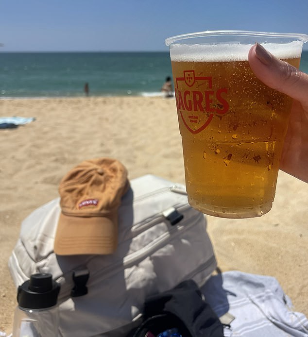While sunbathing, Layla settled down with a refreshing €2.50 (£2.17) pint of Sagres she bought from one of the trendy bars and terraced restaurants that are drip-fed along the beach