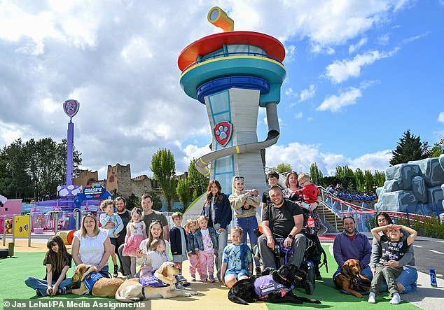 Dani Dyer with her children Santiago, Summer and Star welcome assistance dogs and their families to a preview of World of Paw Patrol at Chessington on April 27, a week before it opened