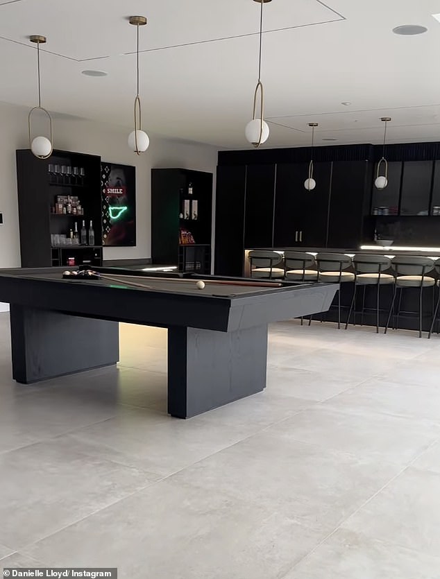 Giving a peek inside she revealed the huge kitchen diner, luxurious bedrooms with walk in wardrobes and neutral living room