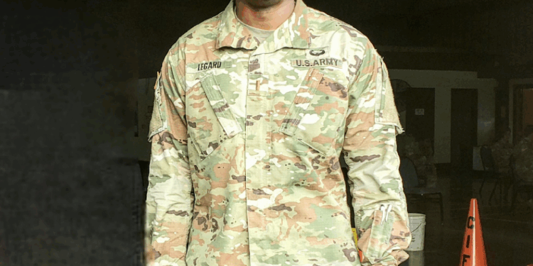 Rashan Legard posing in his military uniform.