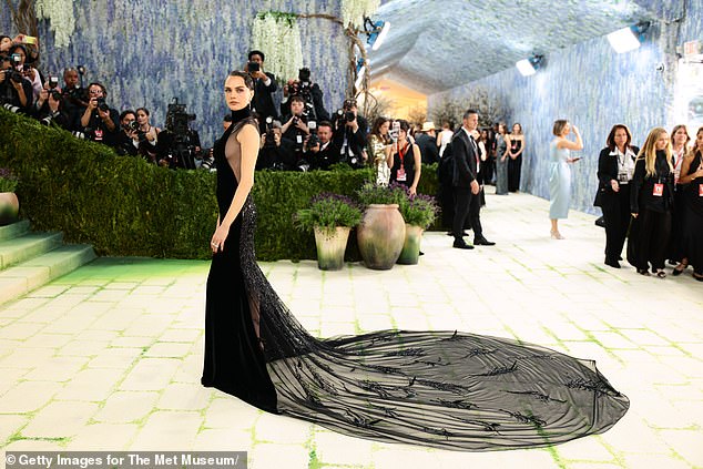 Cara Delevingne flashed her sideboob in a sheer black gown with a train