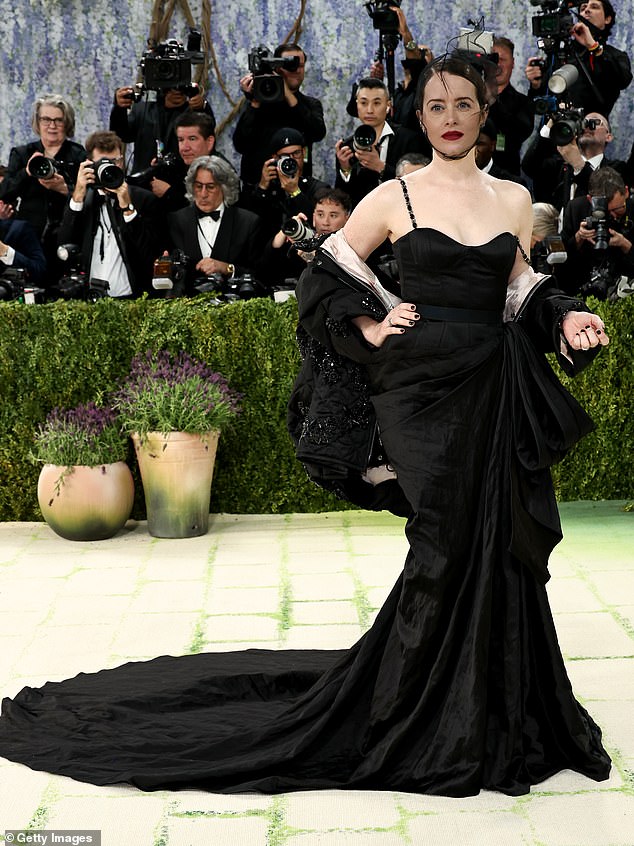 The Crown star Claire, 42, looked equally glamours in her bespoke ERDEM corset gown with jewelled chain straps and asymmetric hand draped skirt