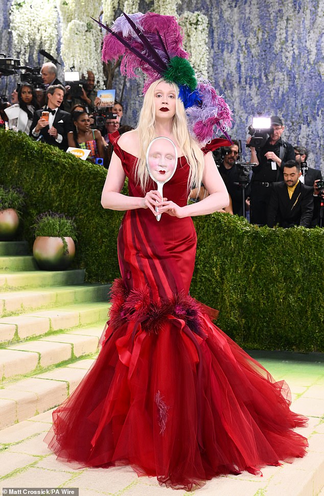 Elsewhere on the red carpet Gwendoline Christie, 47, caught the eye in a red vintage inspired fishtail gown with feathered and tulle trim