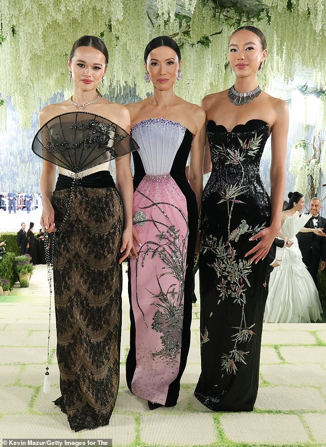 Chloe, 23, meanwhile sported a black strapless gown featuring bird of paradise-inspired embroidery, intricate silver beading and a scalloped sweetheart neckline