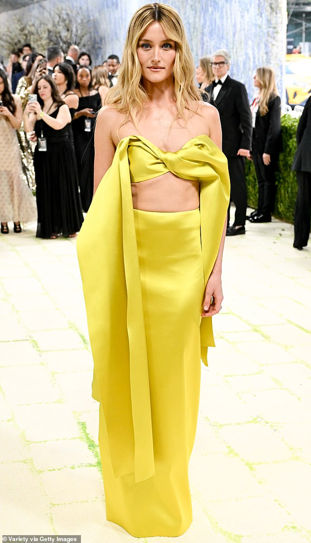Pidgeon was radiant in an eye-catching dress that comprised of yellow fabric around the bust which was styled into a bow as the material fell down her sides