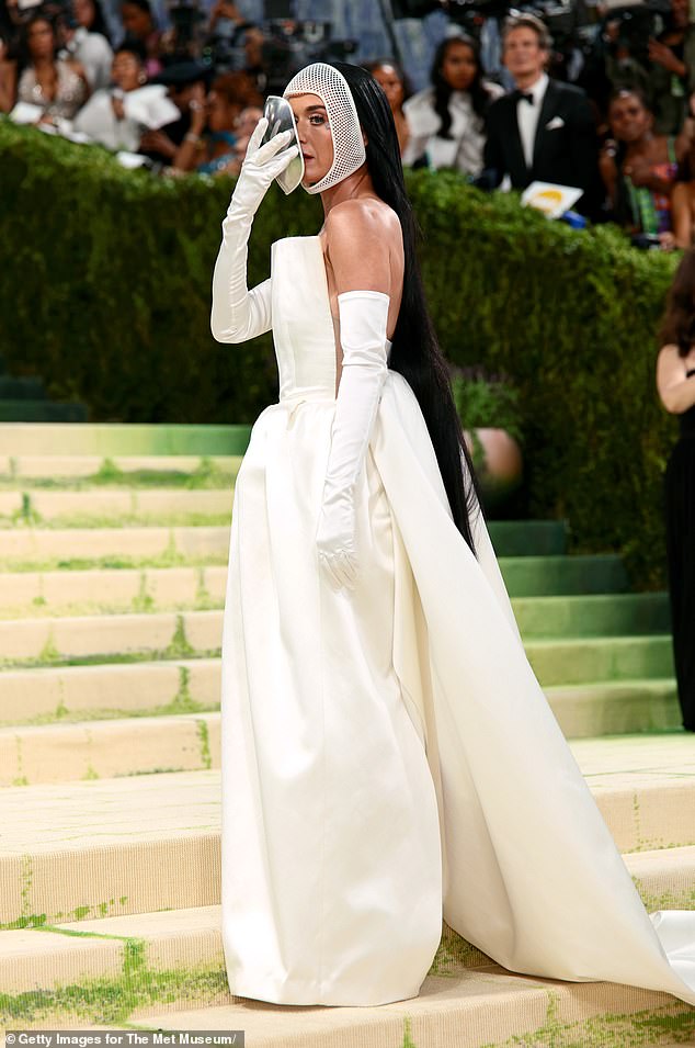 Her signature raven-colored locks were pulled back as they cascaded down her back as she wore complementary make-up