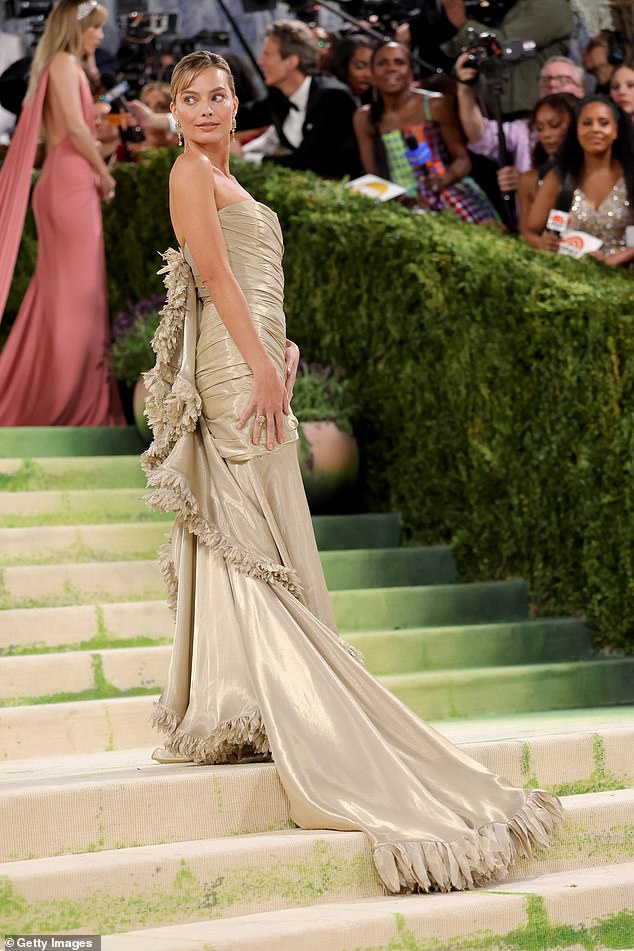 Details of Margot's beautiful train were seen as she strutted on the famous stairs at the  Metropolitan Museum of Art