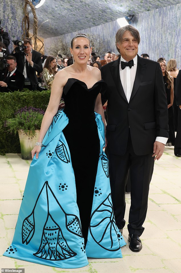Some people feel that the event has now become a 'dystopian' parade of billionaires and influencers. George Soros's son, Robert Soros, at the event with his wife, Jamie Singer Soros