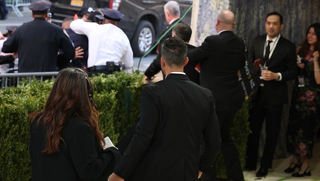 The man attempted to jump over the barricades in order to rush the steps of the star-studded event