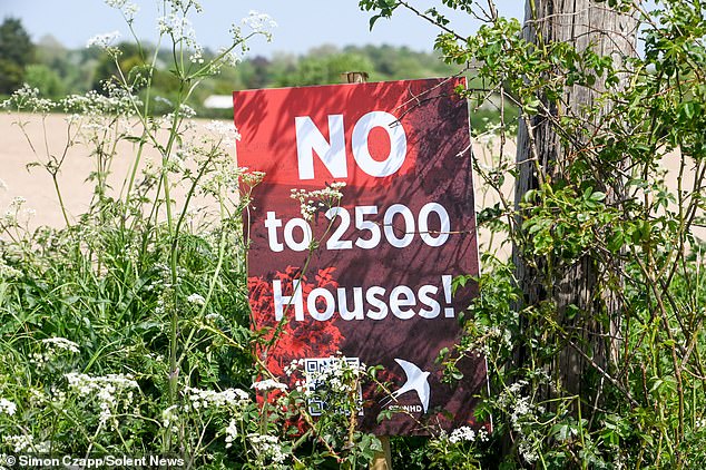 Residents claim the homes, which could virtually connect the area with neighbouring Basingstoke, will destroy their local village