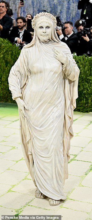 Heidi Klum leaned all the way into the theme, arriving in a look that could only be described as a living statue