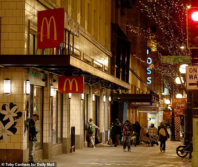 A group of vagrants can be seen congregating outside the McDonald's, on the corner of 3rd Avenue and Pine Street, pictured in January
