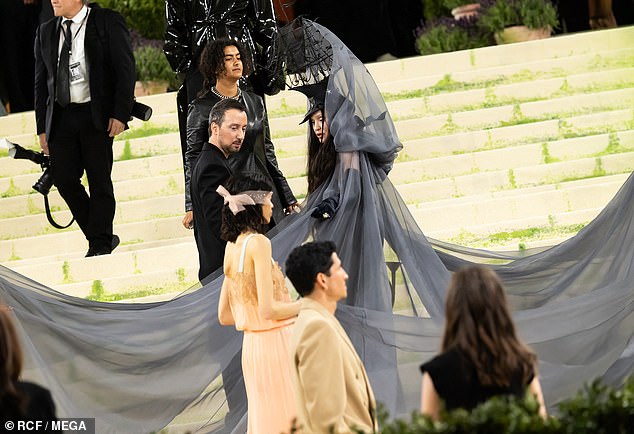 The Rebel Heart singer also fussed with her long pale gray veil