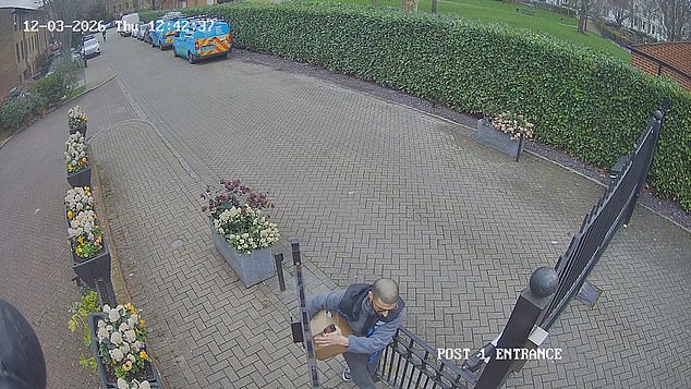 Sadeghi is caught leaving the gated Mews, with the packages underneath his arm
