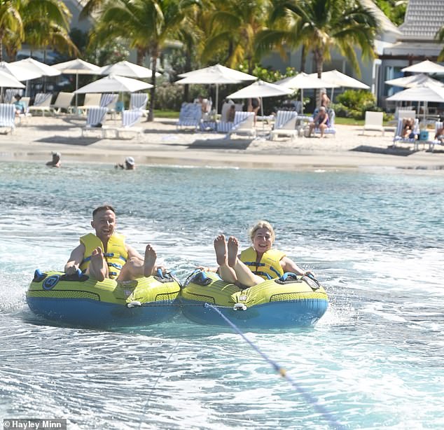 During the trip, the pair enjoy time in the sea - from snorkelling to tubing (pictured) - and found the crystal-clear water was full of marine life