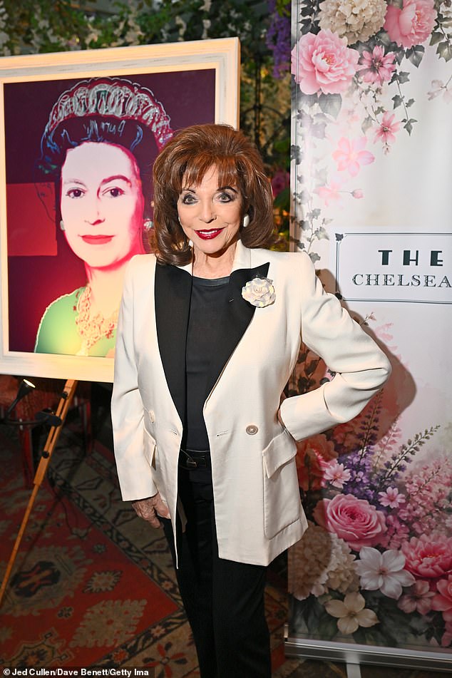 Known for always oozing Hollywood glamour, Joan looked as chic as ever in a white satin tuxedo-style jacket with a rose pinned to the lapel