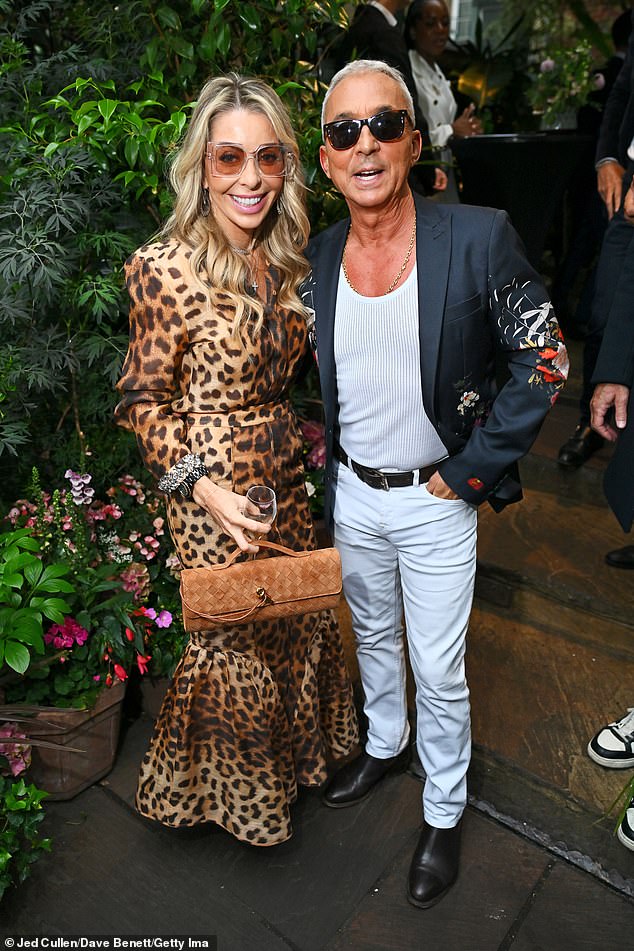 The ballroom judge caught the eye in a mesh vest and white trousers with a grey blazer adorned in a colourful floral design (pictured with Juliet Mayhew)