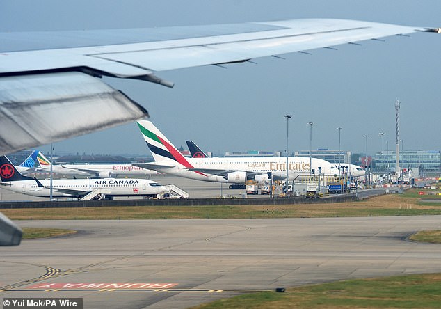 Planes on the ground at London Heathrow Airport's Terminal Five on Sunday