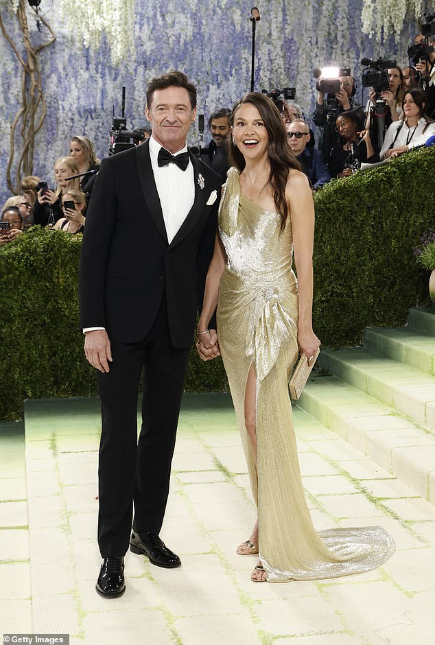 Sutton was the picture of elegance in a glittering gold one-shoulder gown with a matching jewelled clutch