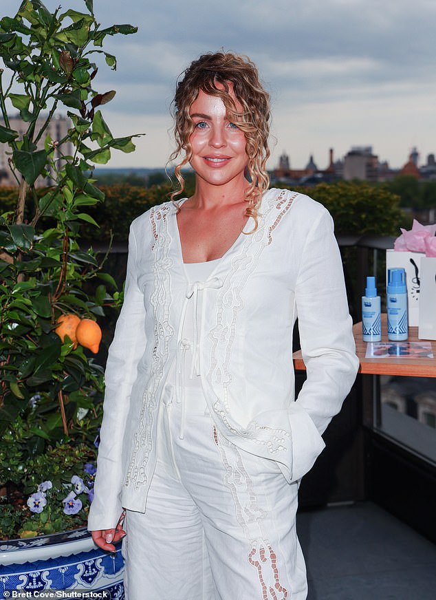 Lydia looked effortlessly chic in a pair of broderie anglaise trousers with a matching tie-front cardigan, while Debbie was ethereal in a long dress with a colourful feather pattern at the hem