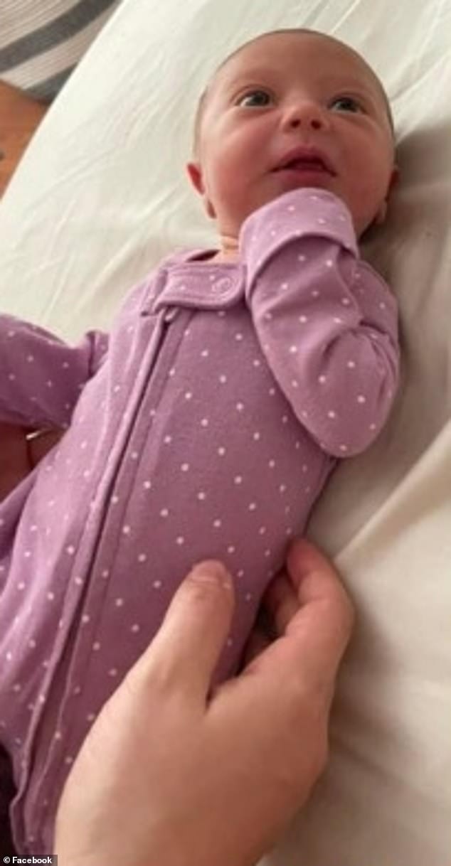 The couple's four-year-old daughter (pictured at her birth) was killed alongside her baby sibling and mother