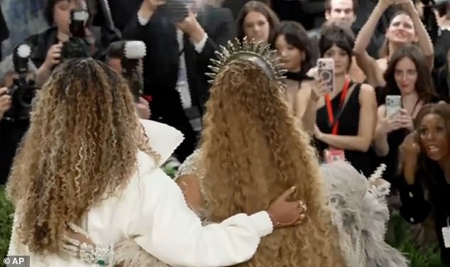 The clip shows Blue posing with her mom before Beyonce's publicist Yvette Noel-Schure (right) rushes over, gesturing for the teen to take off her shades