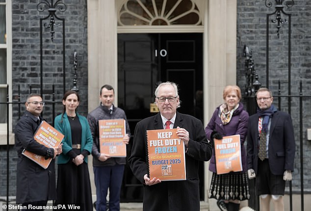 Howard Cox, founder of the FairFuelUK campaign group (front, centre) said it was 'barmy' to include Net Zero figures within pothole targets