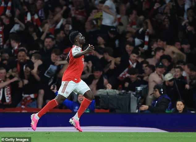 Bukayo Saka celebrates after scoring the goal that sent Arsenal to only their second Champions League final in their history