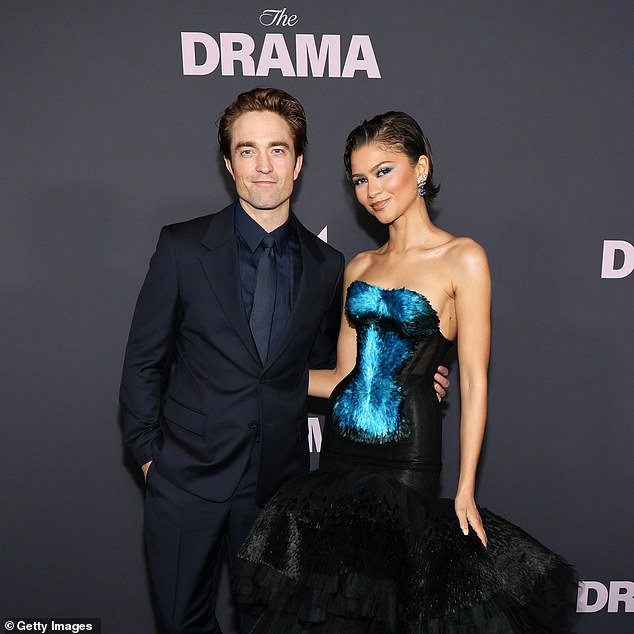 With Robert Pattinson while promoting The Drama in April