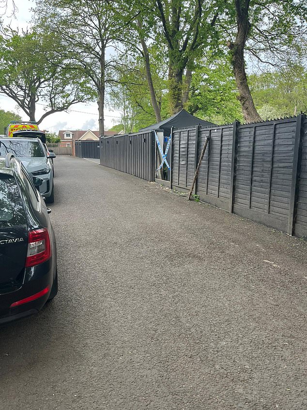 Officers are understood to have knocked through a wooden fence to get into the compound on Wednesday morning