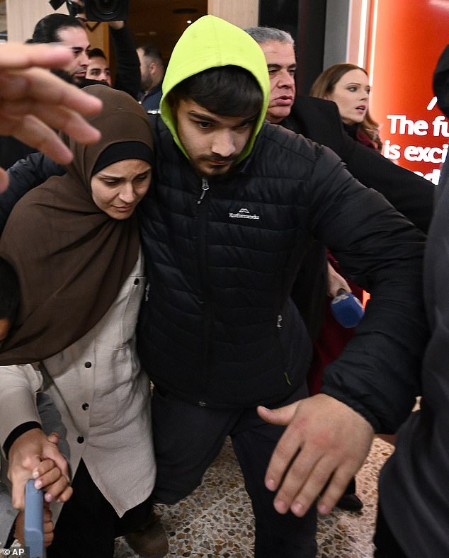 Ms Ahmad's two eldest sons - 12-year-old Omar and 14-year-old Mohammad - were not by her side at the airport